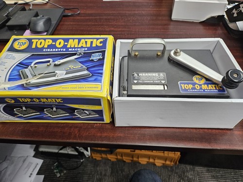Top matic cigarette rolling - top-o-matic,